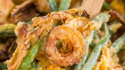 Delicious green bean casserole topped with crispy onions and creamy sauce
