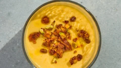 Mango Lassi Panna Cotta garnished with saffron and pistachio brittle