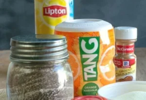 A steaming cup of quick and easy spiced tea garnished with spices