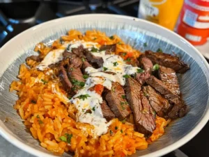 Delicious steak queso rice recipe with savory steak and creamy queso on rice.