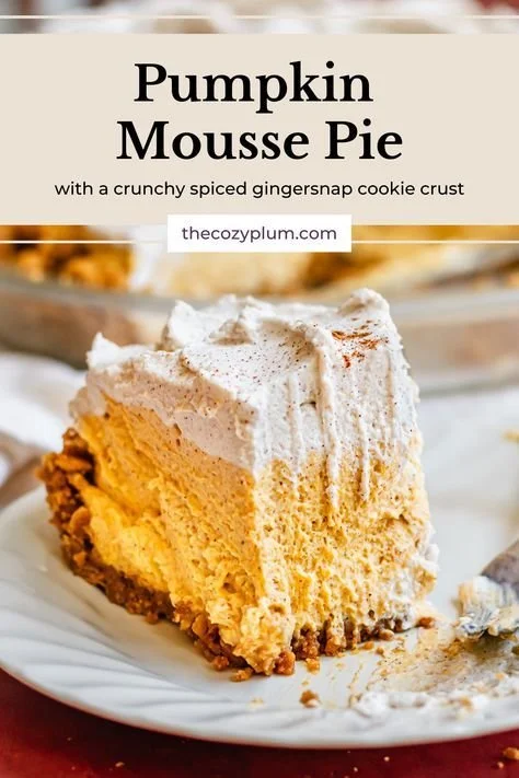 Fluffy no-bake pumpkin mousse pie topped with whipped cream and spices.
